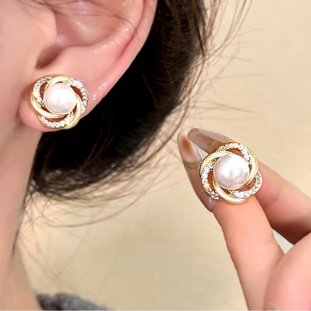 3/$20. Gold and Pearl Swirl Earrings